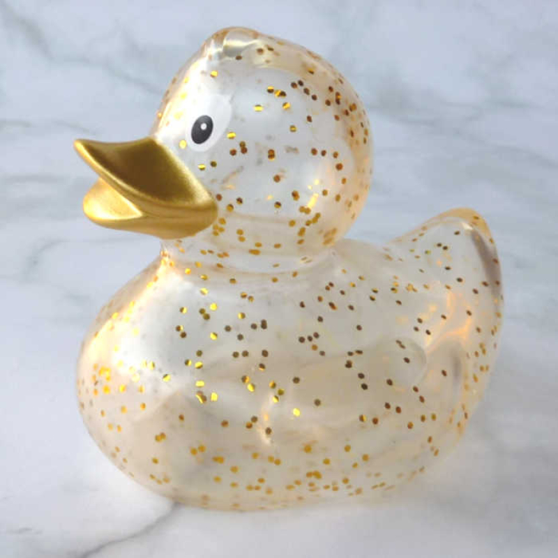 Glamouröse goldglitzernde Badeente Quietscheente